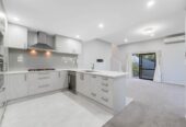 Modern Split-Level Living with Income Potential, 4 beds 3 baths house with garage on 574m2 section, close to schools, shops, motorway access, 0.7 km to Royal Road School, 5A Benchmark Drive, Massey, Auckland