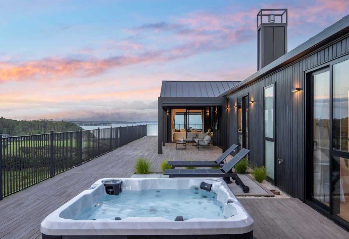 4 beds 3 baths house with double garage on 1897m2 section, A massive 180 m2 deck designed for legendary summer gatherings. Located in a secure, gated community, 3.4 km to Long Bay School, 11 Te Rata Road, Okura Bush, Auckland