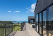 4 beds 3 baths house with double garage on 1897m2 section, A massive 180 m2 deck designed for legendary summer gatherings. Located in a secure, gated community, 3.4 km to Long Bay School, 11 Te Rata Road, Okura Bush, Auckland