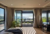 4 beds 3 baths house with double garage on 1897m2 section, A massive 180 m2 deck designed for legendary summer gatherings. Located in a secure, gated community, 3.4 km to Long Bay School, 11 Te Rata Road, Okura Bush, Auckland