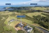 4 beds 3 baths house with double garage on 1897m2 section, A massive 180 m2 deck designed for legendary summer gatherings. Located in a secure, gated community, 3.4 km to Long Bay School, 11 Te Rata Road, Okura Bush, Auckland