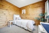 4 beds 2 baths house with double garage and views, Construction: Durable Hardiplank exterior with a classic metal tile roof. 1 km to Long Bay College, 1/15 Flavia Close, Torbay, Auckland