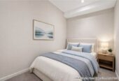 Auckland Girls’ Grammar School zone, Freehold 2 beds 1 bath apartment, 85sqm including a large balcony of approx. 21sqm, Underfloor heating in bathroom, Current weekly rental income of $670/pw, with a fixed term end on 11 Aug 2026, 205/47 Beach Road, City Centre, Auckland