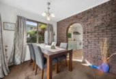 Once in 26 years, Constructed in block, 2 beds 1 bath home with garage, close to Green Bay Village, quality schooling, and public transport, With a park and playground just a short stroll away, 1/39 Cliff View Drive, Green Bay, Auckland