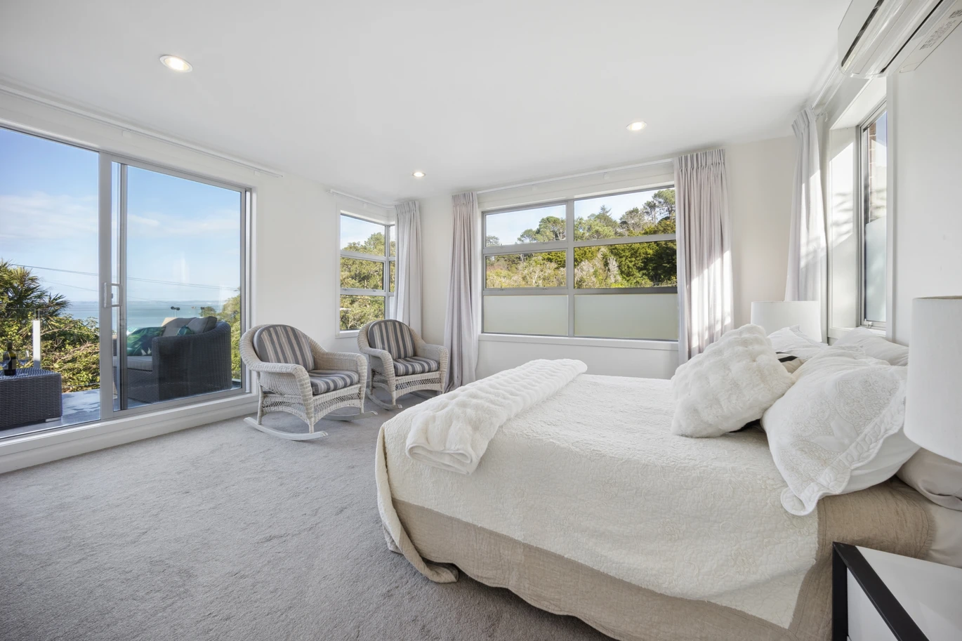 Sea views, 247m2 5 beds 3.5 baths house with double garage on 429m2 section, in an uphill from the harbour’s edge and opposite a native bush reserve, walking distance to Blockhouse Bay Village, local amenities, and coastal reserves, in zone for Blockhouse Bay School and Lynfield College, 48 Lewis Street, Blockhouse Bay, Auckland