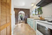 Once in 26 years, Constructed in block, 2 beds 1 bath home with garage, close to Green Bay Village, quality schooling, and public transport, With a park and playground just a short stroll away, 1/39 Cliff View Drive, Green Bay, Auckland