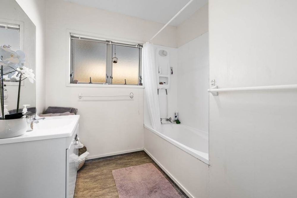 Standalone 3 beds 1 bath house with double garage on 414m2 section, Stroll to Te Atatu Peninsula Market, easy motorway access, 0.2 km to Matipo Road School, 0.9 km to Te Atatu Intermediate, 10A Holman Road, Te Atatu Peninsula, Auckland
