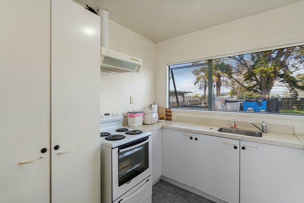 Standalone 3 beds 1 bath house with double garage on 414m2 section, Stroll to Te Atatu Peninsula Market, easy motorway access, 0.2 km to Matipo Road School, 0.9 km to Te Atatu Intermediate, 10A Holman Road, Te Atatu Peninsula, Auckland