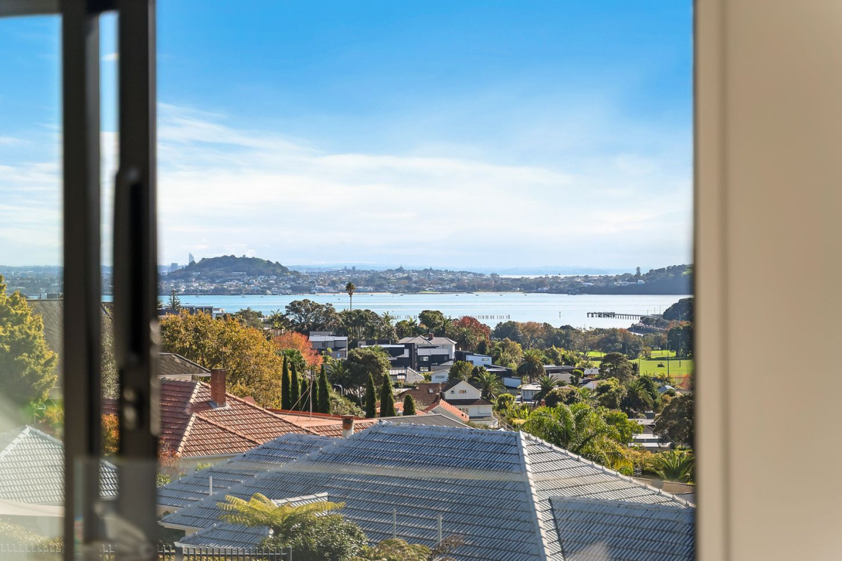 164m2 3 beds 2 baths home with double garage on 191m2 section, mature green fence lines frame the landscape, Both upstairs and downstairs bedrooms are thoughtfully positioned to embrace the water views, 118a Reihana Street, Orakei, Auckland