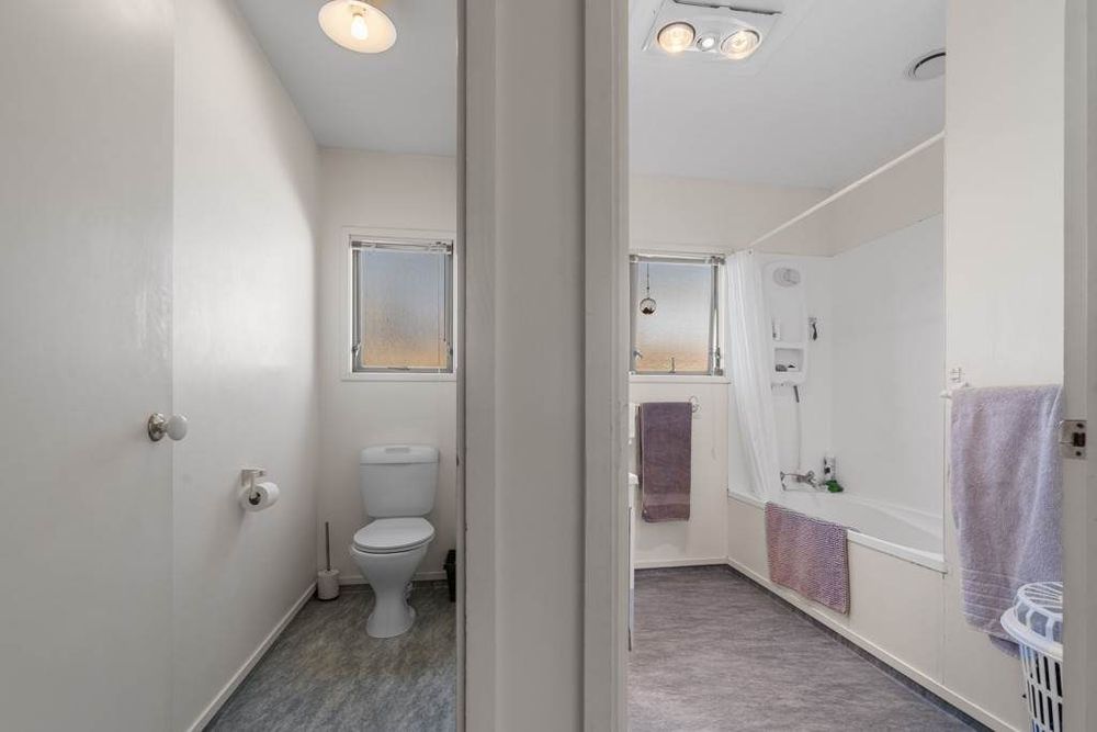 Standalone 3 beds 1 bath house with double garage on 414m2 section, Stroll to Te Atatu Peninsula Market, easy motorway access, 0.2 km to Matipo Road School, 0.9 km to Te Atatu Intermediate, 10A Holman Road, Te Atatu Peninsula, Auckland