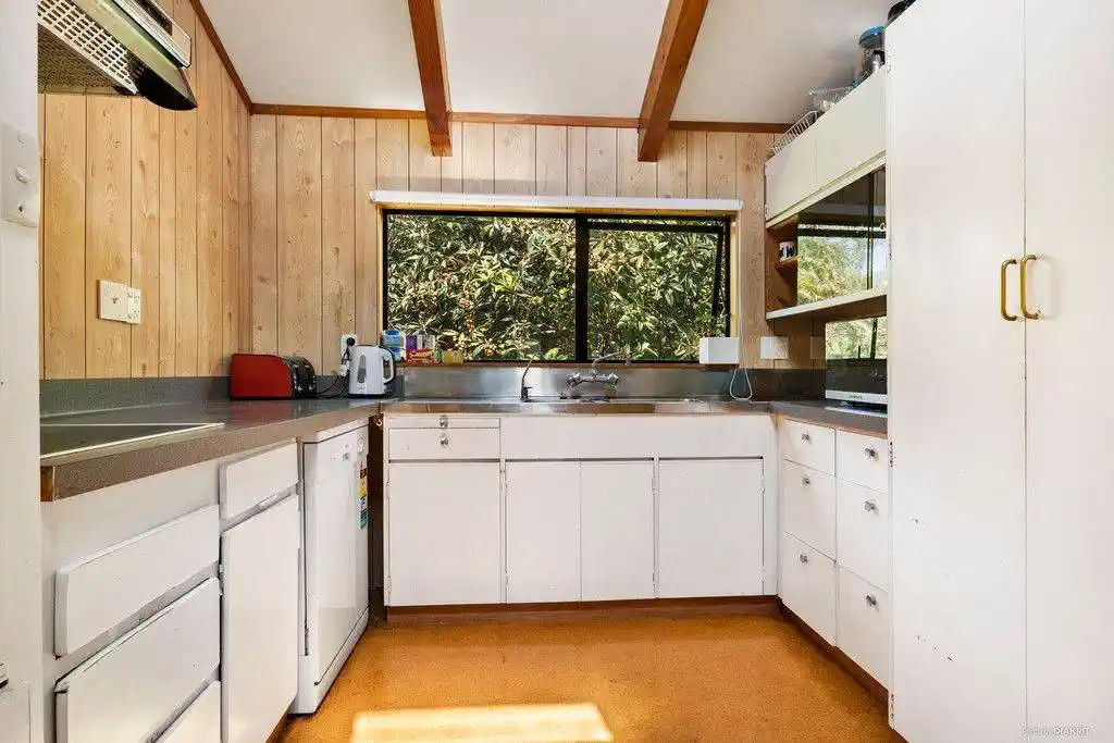 1012m2, 4 beds (1 ensuite) 2 baths house with double garage with RC, EPA for 4 standalone homes, BC in progress, minutes from from Torbay Village shops, cafes, and transport links, beaches, schools, 0.2 km to Torbay School, 59 Hebron Road, Waiake, Auckland