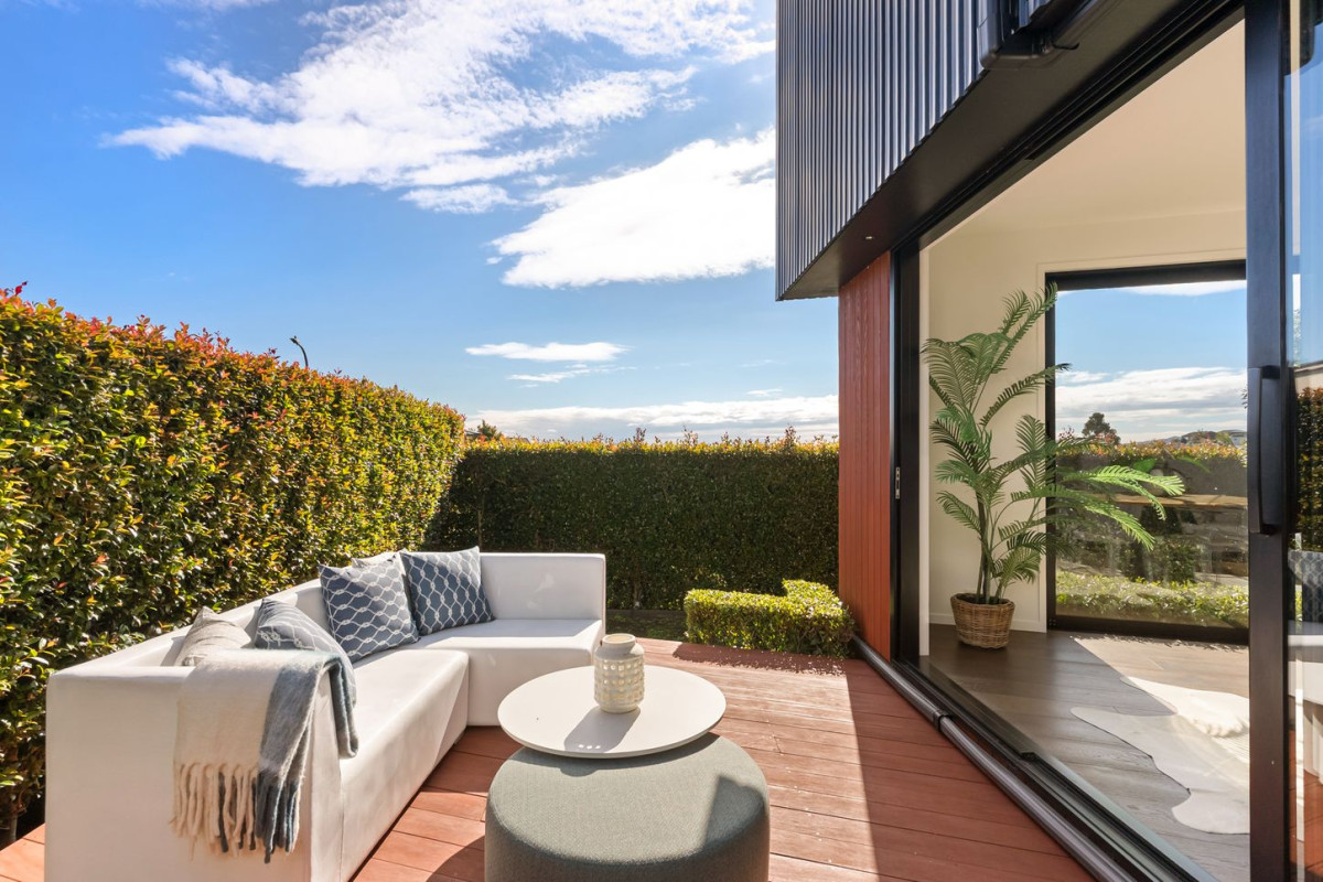 164m2 3 beds 2 baths home with double garage on 191m2 section, mature green fence lines frame the landscape, Both upstairs and downstairs bedrooms are thoughtfully positioned to embrace the water views, 118a Reihana Street, Orakei, Auckland
