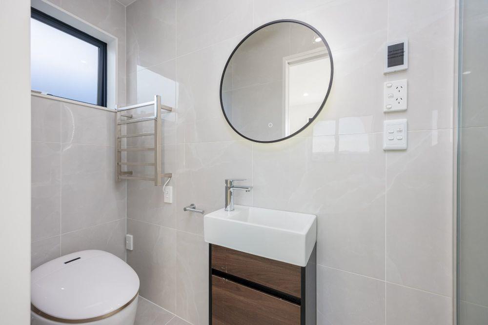 Brandnew standalone 3 beds 2.5 baths house with garage, move-in ready, close to the train station, shops, cafes, schools, child care center and the famous Bruce Pulman Park. Zoned for Kauri Flat School, Mansell Senior School and Papakura High School, 25 John Gray Street, Takanini, Auckland