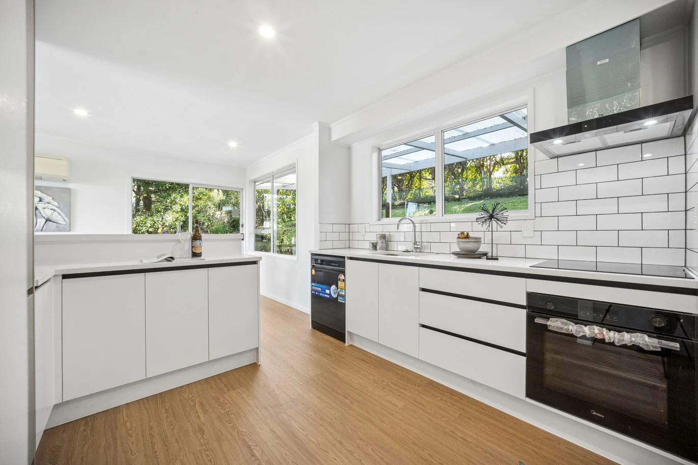 Renovated 3 beds 1 bath house on 1128m2 section, with a deck and pergola, a single garage and additional open parking spaces for up to five vehicles, 12 Glenbervie Crescent Massey,, Auckland