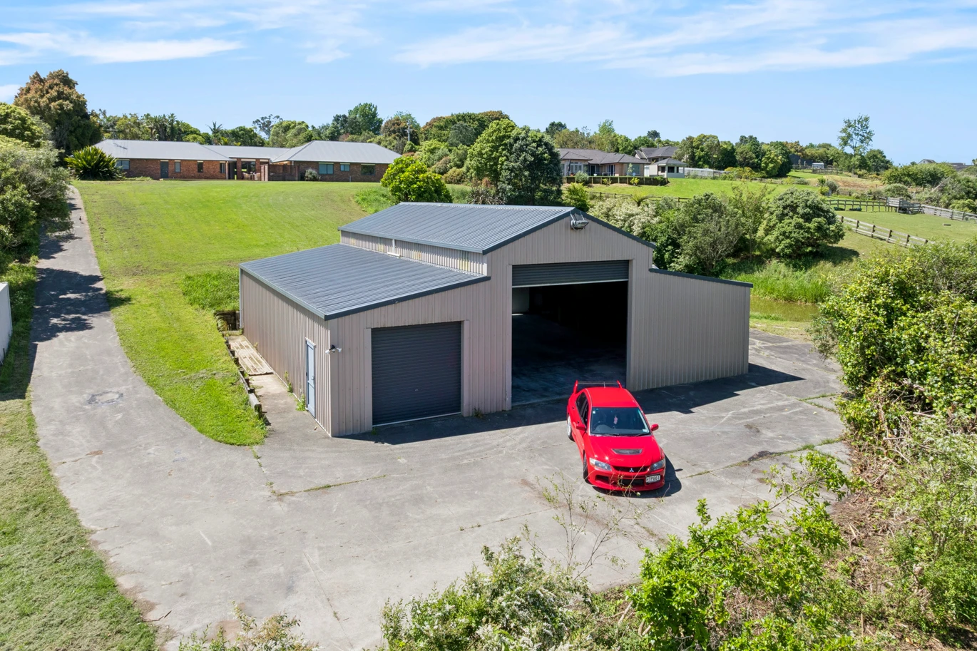 Over 300m2 4 beds 3 baths house with triple garage and a huge standalone workshop on 1.118 ha section, minutes from key transport routes, town amenities, schools, and shopping centres, 38 Lauren Grove Papakura, Auckland