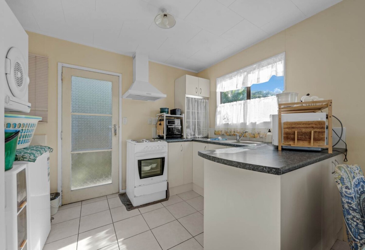 Home and income, 2 Standalone 2 beds 1 bath home with carport on 768m2 section ( one freehold title), currently tenanted, ( 1 tenant 9+ year and 2nd tenant 20+ years), Minutes to WestCity Waitakere shopping centre, schools, easy motorway access, 0.6 km to Waitakere College, 45A Mildmay Road, Henderson, Auckland