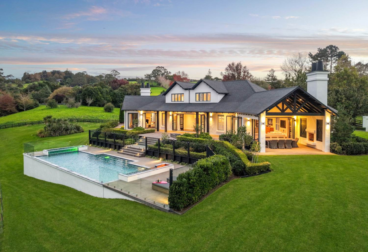 30,269m² section, The home offers 5 beds 3 baths, including a private guest suite with a designer ensuite featuring dual showers, A separate wing accommodates additional bedrooms and a luxurious family bathroom with a sculptural real stone bath, Underfloor heating throughout, A five-car garage, A formal 10-seater dining room beneath a genuine Swarovski crystal chandelier, integrated throughout the home is a premium HEOS multi-room audio system, a fully equipped private cinema with six luxury seats, The stunning 16.5-metre heated swimming pool (approx. 5.5–6m wide), 2.2 km to Riverhead School, 739 Coatesville-Riverhead Highway, Riverhead, Auckland