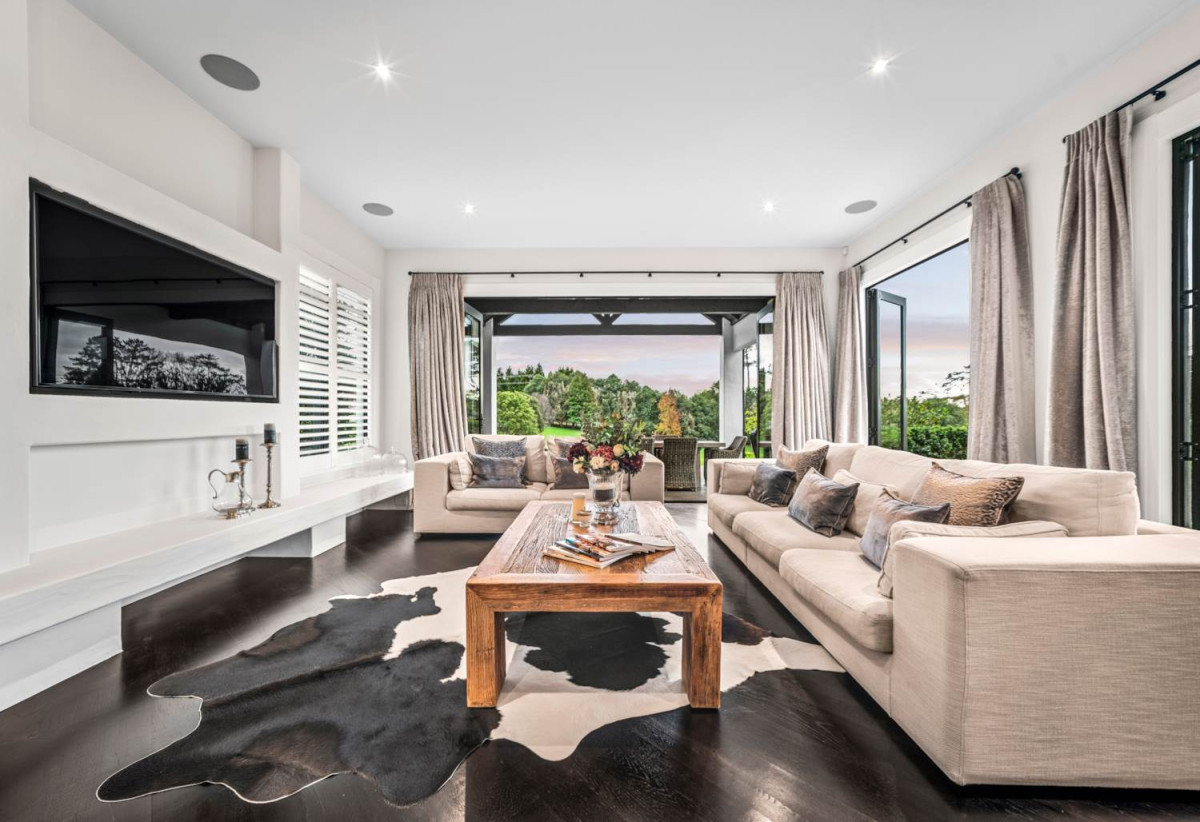 30,269m² section, The home offers 5 beds 3 baths, including a private guest suite with a designer ensuite featuring dual showers, A separate wing accommodates additional bedrooms and a luxurious family bathroom with a sculptural real stone bath, Underfloor heating throughout, A five-car garage, A formal 10-seater dining room beneath a genuine Swarovski crystal chandelier, integrated throughout the home is a premium HEOS multi-room audio system, a fully equipped private cinema with six luxury seats, The stunning 16.5-metre heated swimming pool (approx. 5.5–6m wide), 2.2 km to Riverhead School, 739 Coatesville-Riverhead Highway, Riverhead, Auckland
