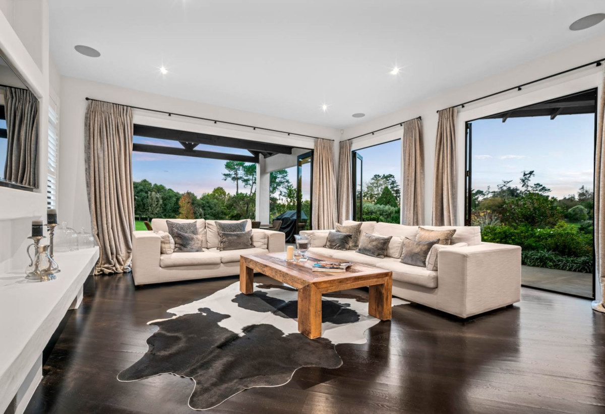 30,269m² section, The home offers 5 beds 3 baths, including a private guest suite with a designer ensuite featuring dual showers, A separate wing accommodates additional bedrooms and a luxurious family bathroom with a sculptural real stone bath, Underfloor heating throughout, A five-car garage, A formal 10-seater dining room beneath a genuine Swarovski crystal chandelier, integrated throughout the home is a premium HEOS multi-room audio system, a fully equipped private cinema with six luxury seats, The stunning 16.5-metre heated swimming pool (approx. 5.5–6m wide), 2.2 km to Riverhead School, 739 Coatesville-Riverhead Highway, Riverhead, Auckland