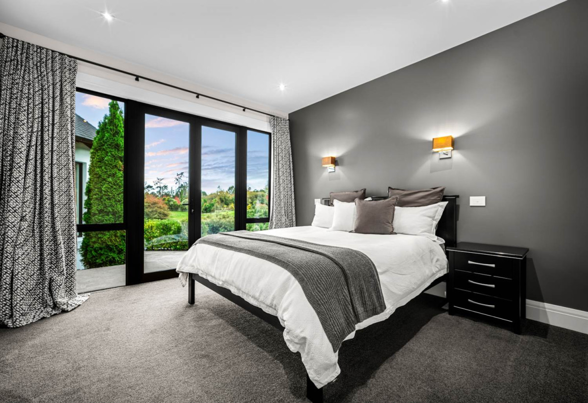 30,269m² section, The home offers 5 beds 3 baths, including a private guest suite with a designer ensuite featuring dual showers, A separate wing accommodates additional bedrooms and a luxurious family bathroom with a sculptural real stone bath, Underfloor heating throughout, A five-car garage, A formal 10-seater dining room beneath a genuine Swarovski crystal chandelier, integrated throughout the home is a premium HEOS multi-room audio system, a fully equipped private cinema with six luxury seats, The stunning 16.5-metre heated swimming pool (approx. 5.5–6m wide), 2.2 km to Riverhead School, 739 Coatesville-Riverhead Highway, Riverhead, Auckland