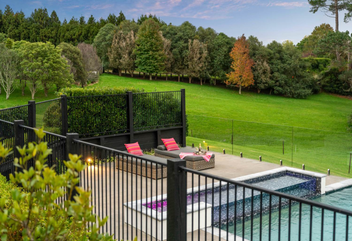 30,269m² section, The home offers 5 beds 3 baths, including a private guest suite with a designer ensuite featuring dual showers, A separate wing accommodates additional bedrooms and a luxurious family bathroom with a sculptural real stone bath, Underfloor heating throughout, A five-car garage, A formal 10-seater dining room beneath a genuine Swarovski crystal chandelier, integrated throughout the home is a premium HEOS multi-room audio system, a fully equipped private cinema with six luxury seats, The stunning 16.5-metre heated swimming pool (approx. 5.5–6m wide), 2.2 km to Riverhead School, 739 Coatesville-Riverhead Highway, Riverhead, Auckland