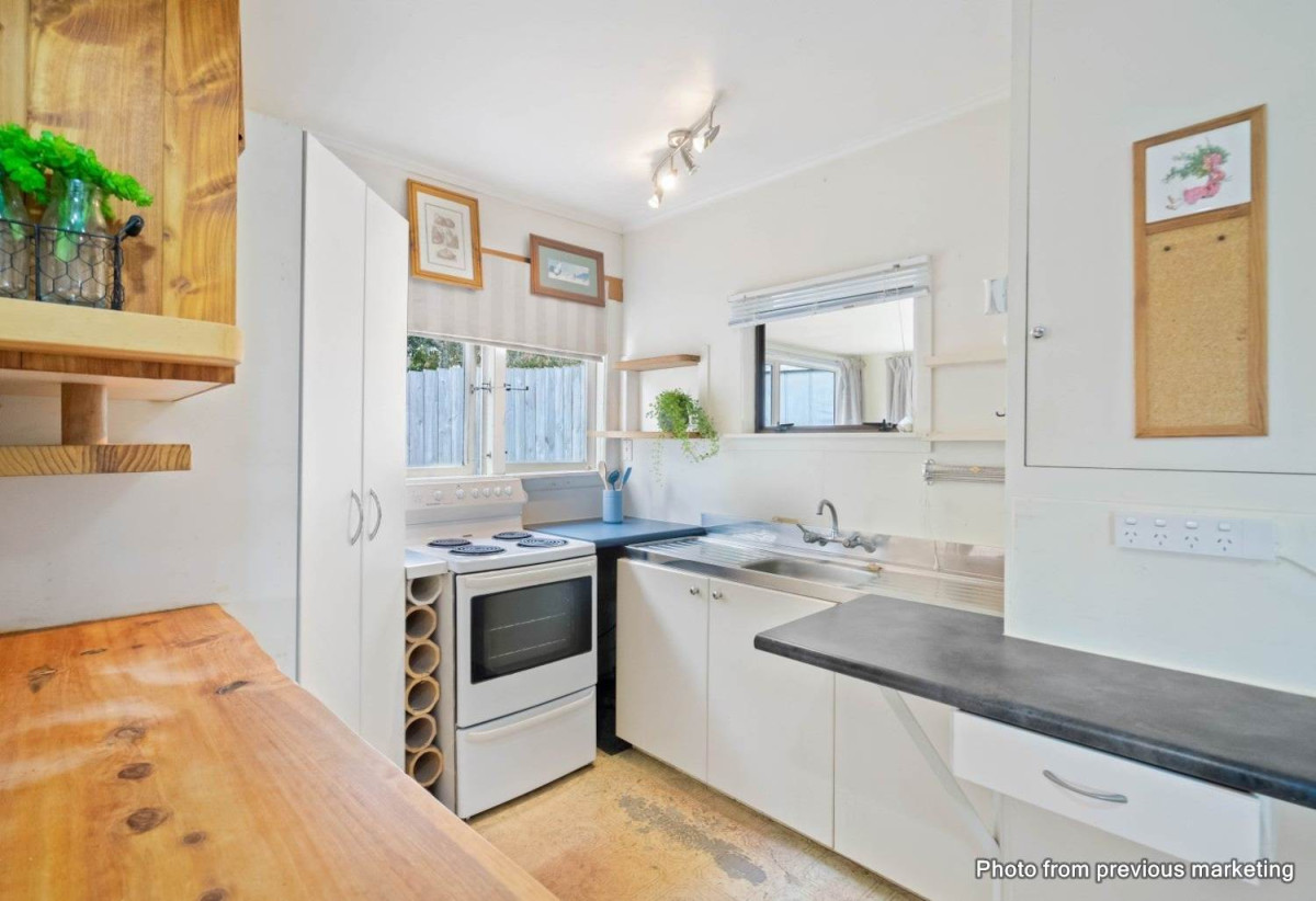 The vendor is under pressure and needs it go, 2 standalone Dwellings on 837m2 section, Front dwelling offers multiple bedrooms, bathroom facilities, and double garage, Rear home has been modified from its original layout and offers additional living space, close to beaches, shops, and local amenities, 1.1 km to Stanmore Bay School, 4 Brian Crescent, Stanmore Bay, Auckland