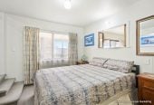 The vendor is under pressure and needs it go, 2 standalone Dwellings on 837m2 section, Front dwelling offers multiple bedrooms, bathroom facilities, and double garage, Rear home has been modified from its original layout and offers additional living space, close to beaches, shops, and local amenities, 1.1 km to Stanmore Bay School, 4 Brian Crescent, Stanmore Bay, Auckland