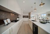 278m2 5 beds (1 ensuite) 3 baths house with double garage on 526m2 section, Downstairs 2 beds + large study room 1 bath and 1 lounge, central ducted air-conditioning, a professional-grade golf putting green and deck, close to schools, Silverdale Mall, motorway access, 1.4 km to Orewa Primary School, 29 Kaupeka Road, Millwater, Auckland