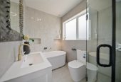 278m2 5 beds (1 ensuite) 3 baths house with double garage on 526m2 section, Downstairs 2 beds + large study room 1 bath and 1 lounge, central ducted air-conditioning, a professional-grade golf putting green and deck, close to schools, Silverdale Mall, motorway access, 1.4 km to Orewa Primary School, 29 Kaupeka Road, Millwater, Auckland