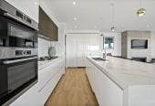 Built-in lift, 251m2 Sea Views 4 beds (2 ensuites) 3 baths home with double garage, Directly opposite Kohimarama School and a short stroll to the waterfront and village amenities, 0.9 km to Selwyn College, 4B Rawhitiroa Road, Kohimarama, Auckland
