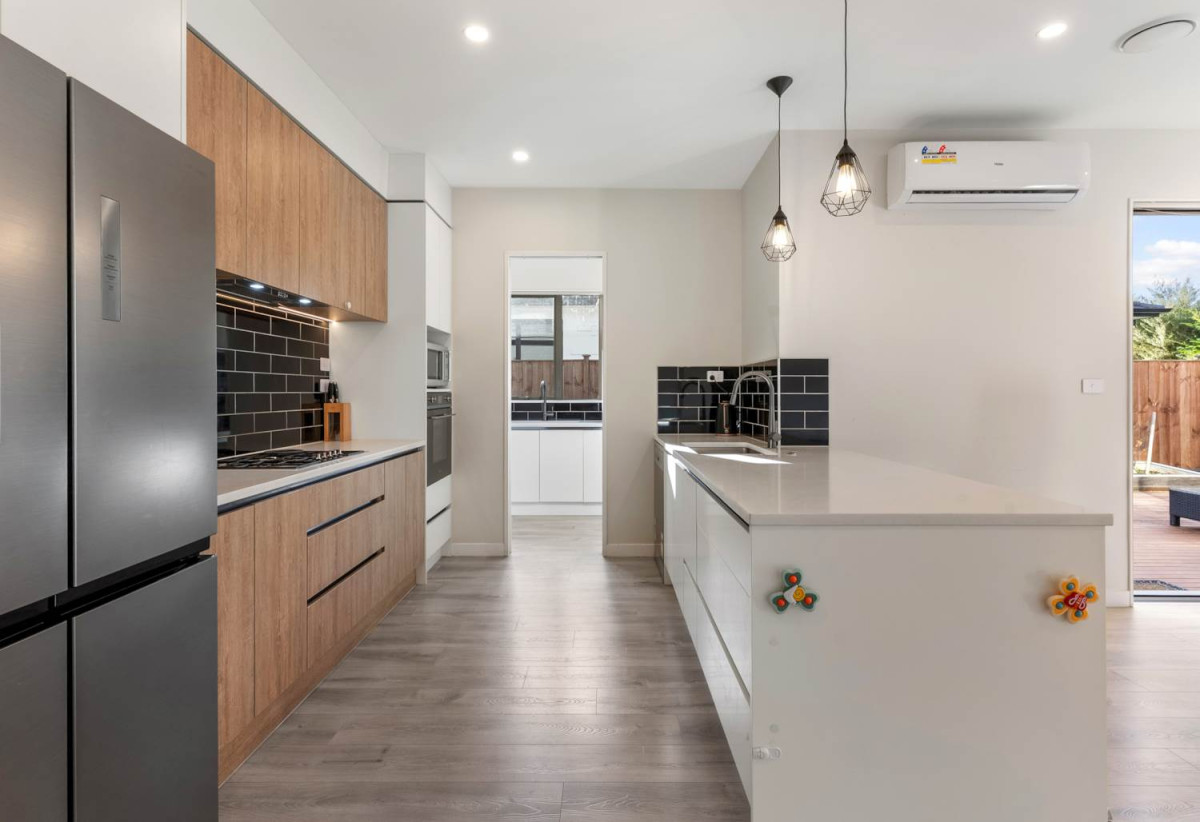 2 kitchens, 4 beds 3 baths house with garage and 1-bed granny on 402m2 section, close to schools, shops, 1 km to Cosgrove School, 9 Holcroft Street, Papakura, Auckland