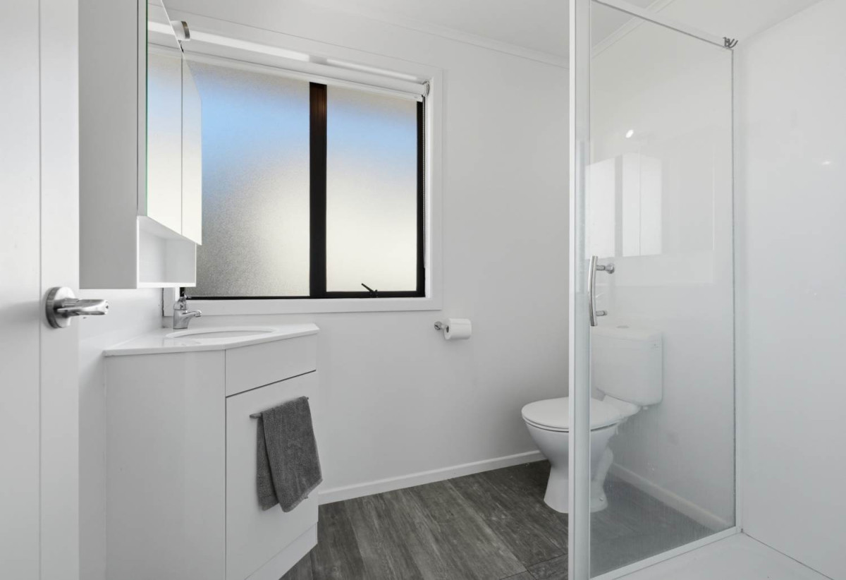 746m2 section, 4 beds (1 ensuite) + study room 2 baths house with garage, Downstairs offers internal access garaging plus a versatile rumpus room, move-in ready, close to schools, shops, supermarkets, 0.2 km to Riverhills School, 127 Ennis Avenue, Pakuranga Heights, Auckland