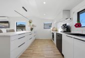 746m2 section, 4 beds (1 ensuite) + study room 2 baths house with garage, Downstairs offers internal access garaging plus a versatile rumpus room, move-in ready, close to schools, shops, supermarkets, 0.2 km to Riverhills School, 127 Ennis Avenue, Pakuranga Heights, Auckland
