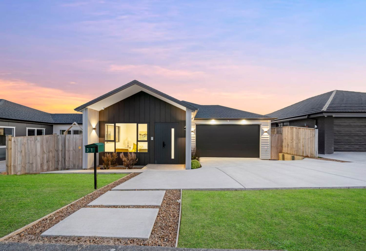 4 beds 3 baths house with double garage on 498m2 section, Set within the peaceful seaside community of Clarks Beach, enjoy weekends are filled with beach walks, golf days, boating adventures, and relaxed evenings spent with family and friends, 31 Korowhiti Road, Clarks Beach, Auckland