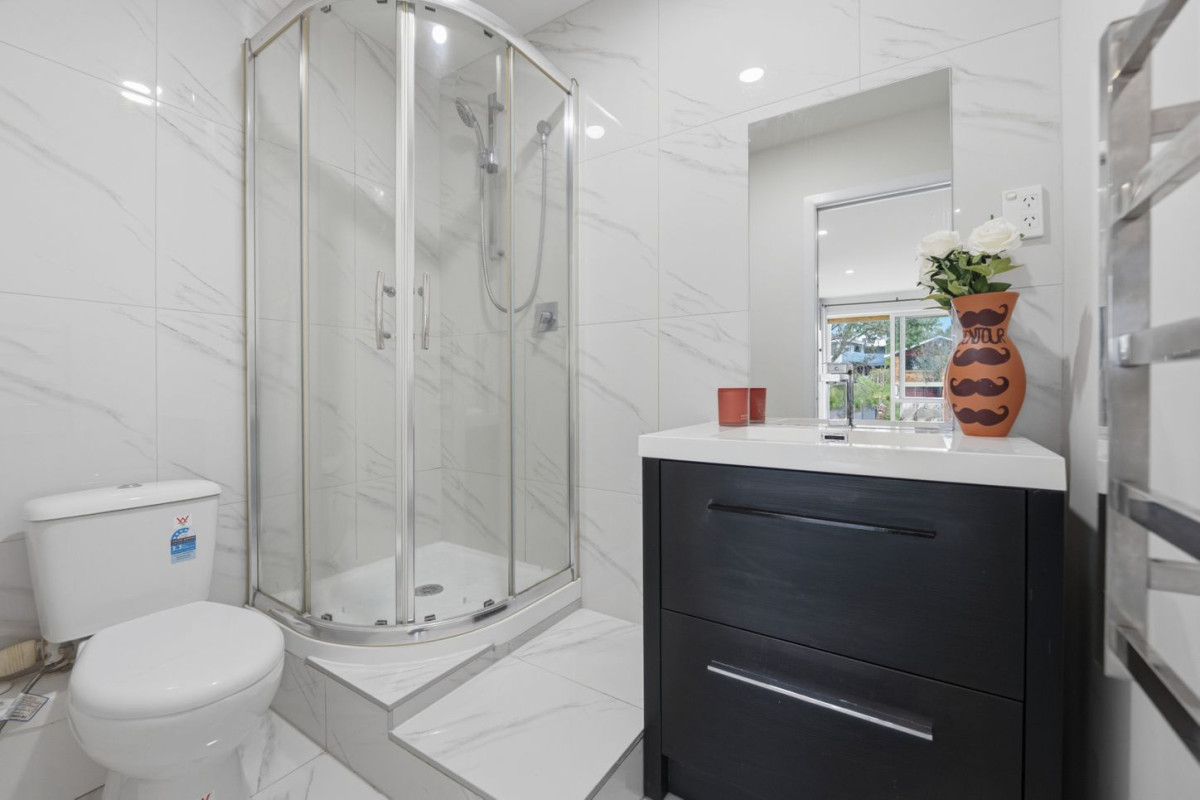 Home and Income, 7A Sailfish Drive, West Harbour, Auckland..160m2 4 beds 3 baths house with car parks on 468m2 section, Solid brick & cedar weatherboard cladding, Separate income area to help offset everyday living costs, close to schools, shops, motorway access & local amenities