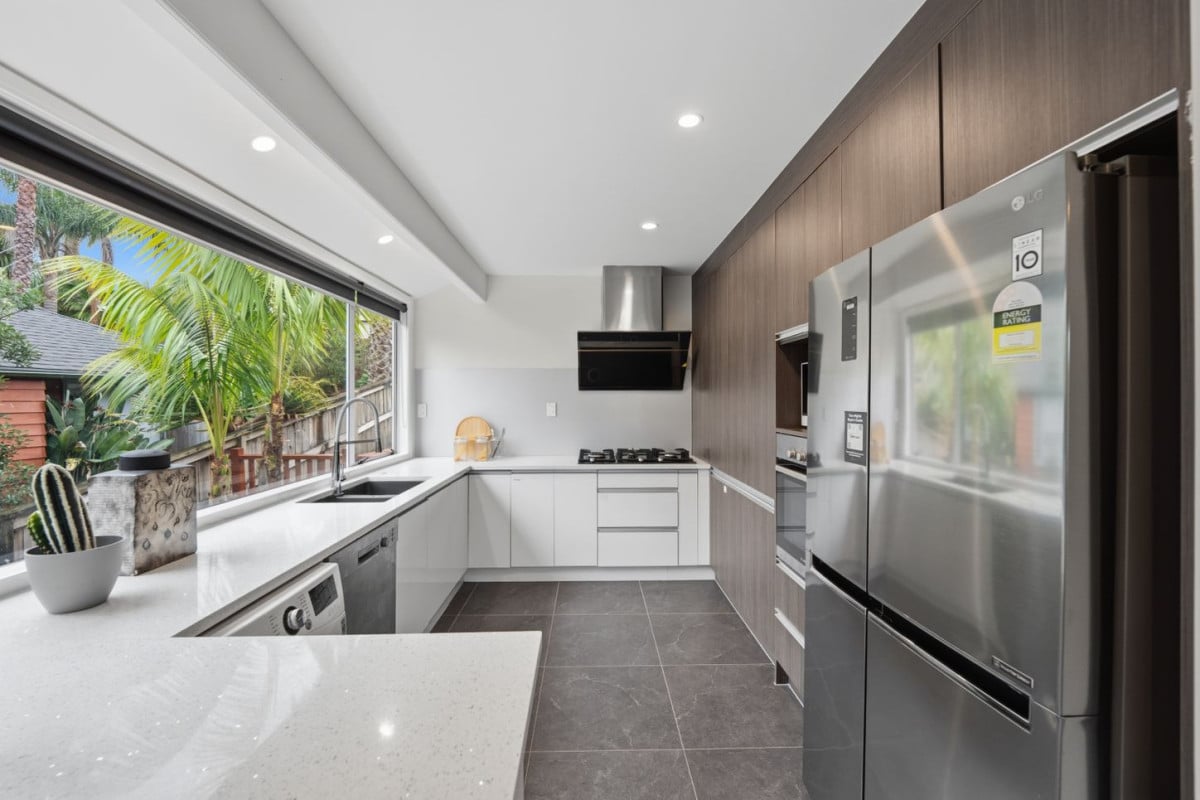 Home and Income, 7A Sailfish Drive, West Harbour, Auckland..160m2 4 beds 3 baths house with car parks on 468m2 section, Solid brick & cedar weatherboard cladding, Separate income area to help offset everyday living costs, close to schools, shops, motorway access & local amenities