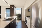 164m2 3 beds 2 baths home with double garage on 191m2 section, mature green fence lines frame the landscape, Both upstairs and downstairs bedrooms are thoughtfully positioned to embrace the water views, 118a Reihana Street, Orakei, Auckland