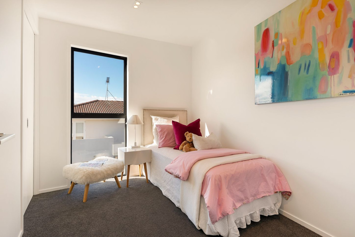 164m2 3 beds 2 baths home with double garage on 191m2 section, mature green fence lines frame the landscape, Both upstairs and downstairs bedrooms are thoughtfully positioned to embrace the water views, 118a Reihana Street, Orakei, Auckland