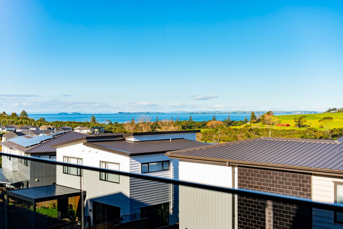 Uninterrupted sea views, 348m2 5 beds 5.5 baths house with double garage and 2-beds granny on 470m2 section, moments from Long Bay Beach and Long Bay Regional Park, shops, supermarket, schools, zoned for Long Bay College, Long Bay School, and Northcross Intermediate, 25 Kumukumu Road, Long Bay, Auckland