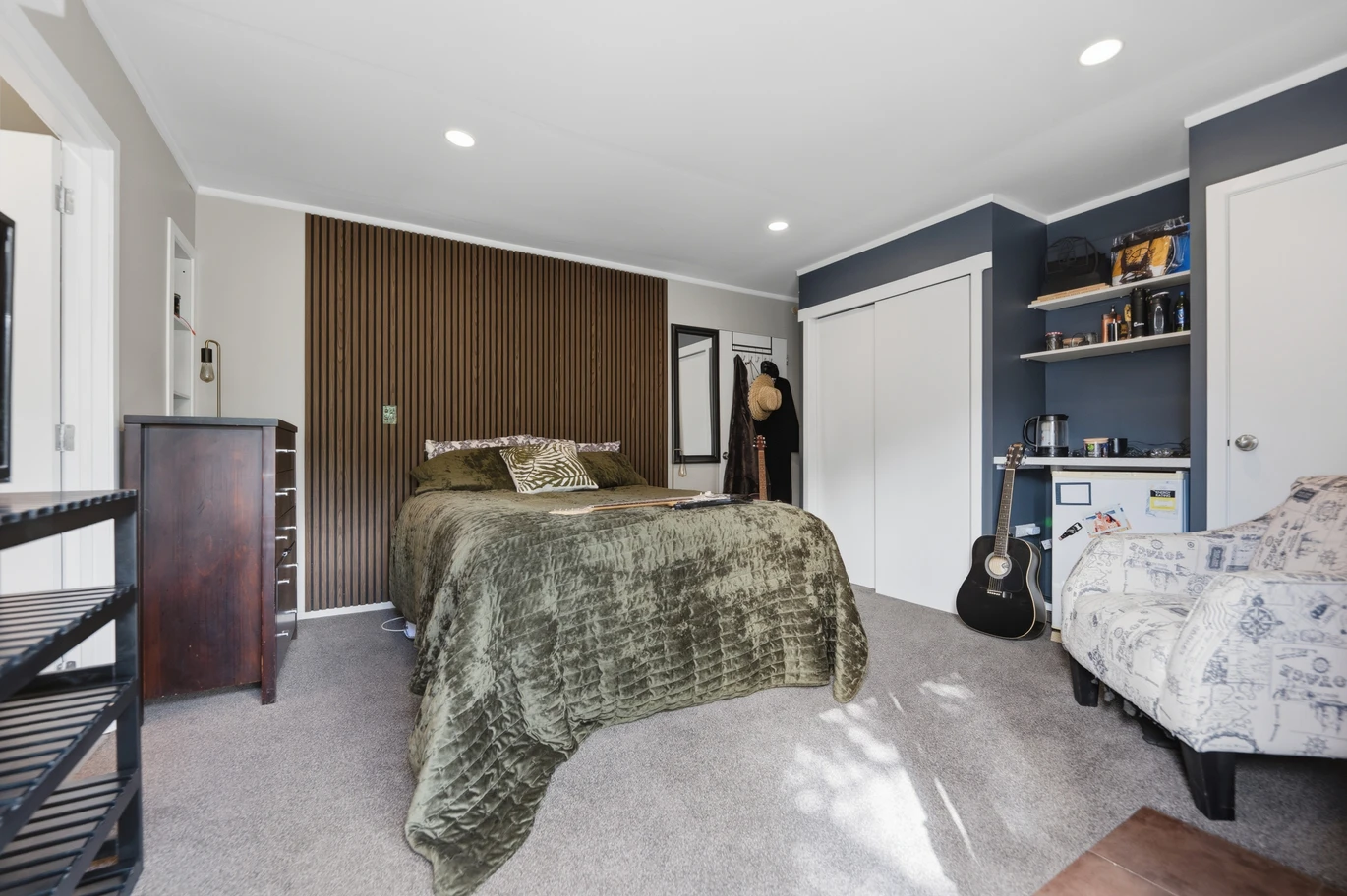 909m2 section, 158m2 4 beds 2 baths main houe PLUS a separate wing/sleepout with a 5th bedroom, bathroom, and covered deck, a massive covered patio with a professional-grade wood-fired pizza oven and a fully equipped outdoor bar area, a large carport, close to reserves, local shops, schools, 23 Tabitha Crescent Henderson, Auckland