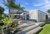 909m2 section, 158m2 4 beds 2 baths main houe PLUS a separate wing/sleepout with a 5th bedroom, bathroom, and covered deck, a massive covered patio with a professional-grade wood-fired pizza oven and a fully equipped outdoor bar area, a large carport, close to reserves, local shops, schools, 23 Tabitha Crescent Henderson, Auckland