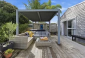 909m2 section, 158m2 4 beds 2 baths main houe PLUS a separate wing/sleepout with a 5th bedroom, bathroom, and covered deck, a massive covered patio with a professional-grade wood-fired pizza oven and a fully equipped outdoor bar area, a large carport, close to reserves, local shops, schools, 23 Tabitha Crescent Henderson, Auckland