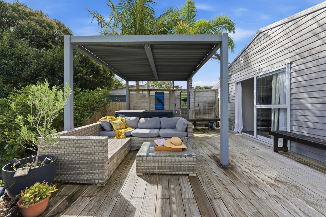 909m2 section, 158m2 4 beds 2 baths main houe PLUS a separate wing/sleepout with a 5th bedroom, bathroom, and covered deck, a massive covered patio with a professional-grade wood-fired pizza oven and a fully equipped outdoor bar area, a large carport, close to reserves, local shops, schools, 23 Tabitha Crescent Henderson, Auckland
