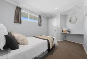 909m2 section, 158m2 4 beds 2 baths main houe PLUS a separate wing/sleepout with a 5th bedroom, bathroom, and covered deck, a massive covered patio with a professional-grade wood-fired pizza oven and a fully equipped outdoor bar area, a large carport, close to reserves, local shops, schools, 23 Tabitha Crescent Henderson, Auckland
