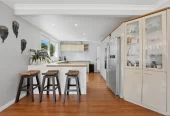 909m2 section, 158m2 4 beds 2 baths main houe PLUS a separate wing/sleepout with a 5th bedroom, bathroom, and covered deck, a massive covered patio with a professional-grade wood-fired pizza oven and a fully equipped outdoor bar area, a large carport, close to reserves, local shops, schools, 23 Tabitha Crescent Henderson, Auckland