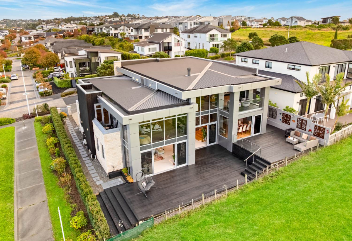 644m2 section, Sea Views, 4 beds (3 ensuites) + over-sized study room 4.5 baths house with double tandem garage (5.9m x 12.4m) for 4 cars, minutes to schools, Long Bay Village, beaches, 0.8 km to Long Bay College, 1.2 km to Long Bay School, 29 Bearing Parade, Long Bay, Auckland