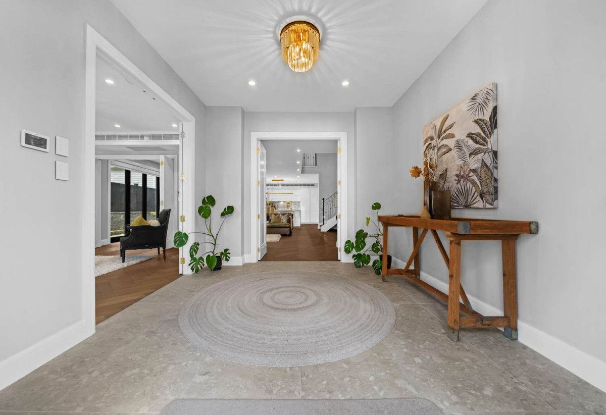 Macleans College zone, 791m2 section, 2 Kitchens, 411m2 Sea Views 6 beds (4 ensuites) 5.5 bathse house with double garaged and 2-beds granny, A striking façade, grand entrance, and elegant lobby make an immediate impression, close to schools, beaches, golf club, shops, 225A Bleakhouse Road, Mellons Bay, Auckland
