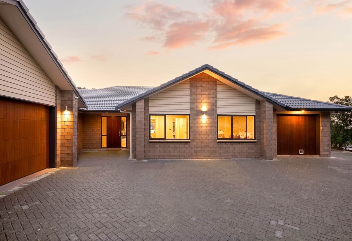 Home and income on 2502m2 section, 2 kitchens, main house 3 beds 2 baths with double garage, a private guest wing 2 beds 1 bath with its own entrance and single garage, overlooking the picturesque Torbay Heights Reserve, Approximately 10 minutes to Albany Mega Centre, close to schools, beach, 1.2 km to Long Bay School, 1.5 km to Long Bay College, 2 km to Northcross Intermediate, 349 Glenvar Road, Long Bay, Auckland