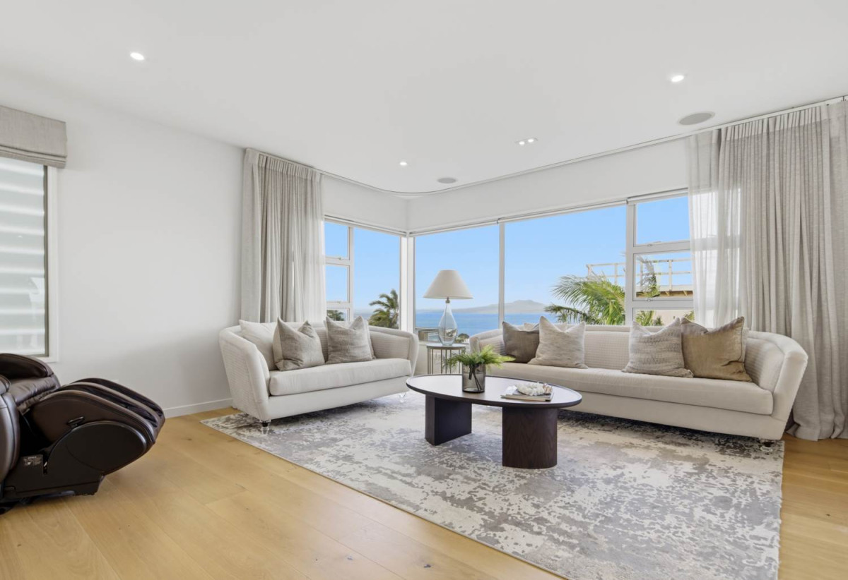 Double Westlake school zone, Breathtaking 180° Views, Sea Views, city skyline views, 640m2 section, 4 beds (2 ensuites) + large office room and rumpus room 3.5 baths house with double garage, 2024 luxury renovated, close to beach, Milford shops, schools, Zoned for Campbells Bay School, Westlake Boys’ and Westlake Girls’ High Schools, and Murrays Bay Intermediate, 62 Seaview Road, Castor Bay, Auckland