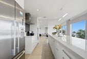 Double Westlake school zone, Breathtaking 180° Views, Sea Views, city skyline views, 640m2 section, 4 beds (2 ensuites) + large office room and rumpus room 3.5 baths house with double garage, 2024 luxury renovated, close to beach, Milford shops, schools, Zoned for Campbells Bay School, Westlake Boys’ and Westlake Girls’ High Schools, and Murrays Bay Intermediate, 62 Seaview Road, Castor Bay, Auckland
